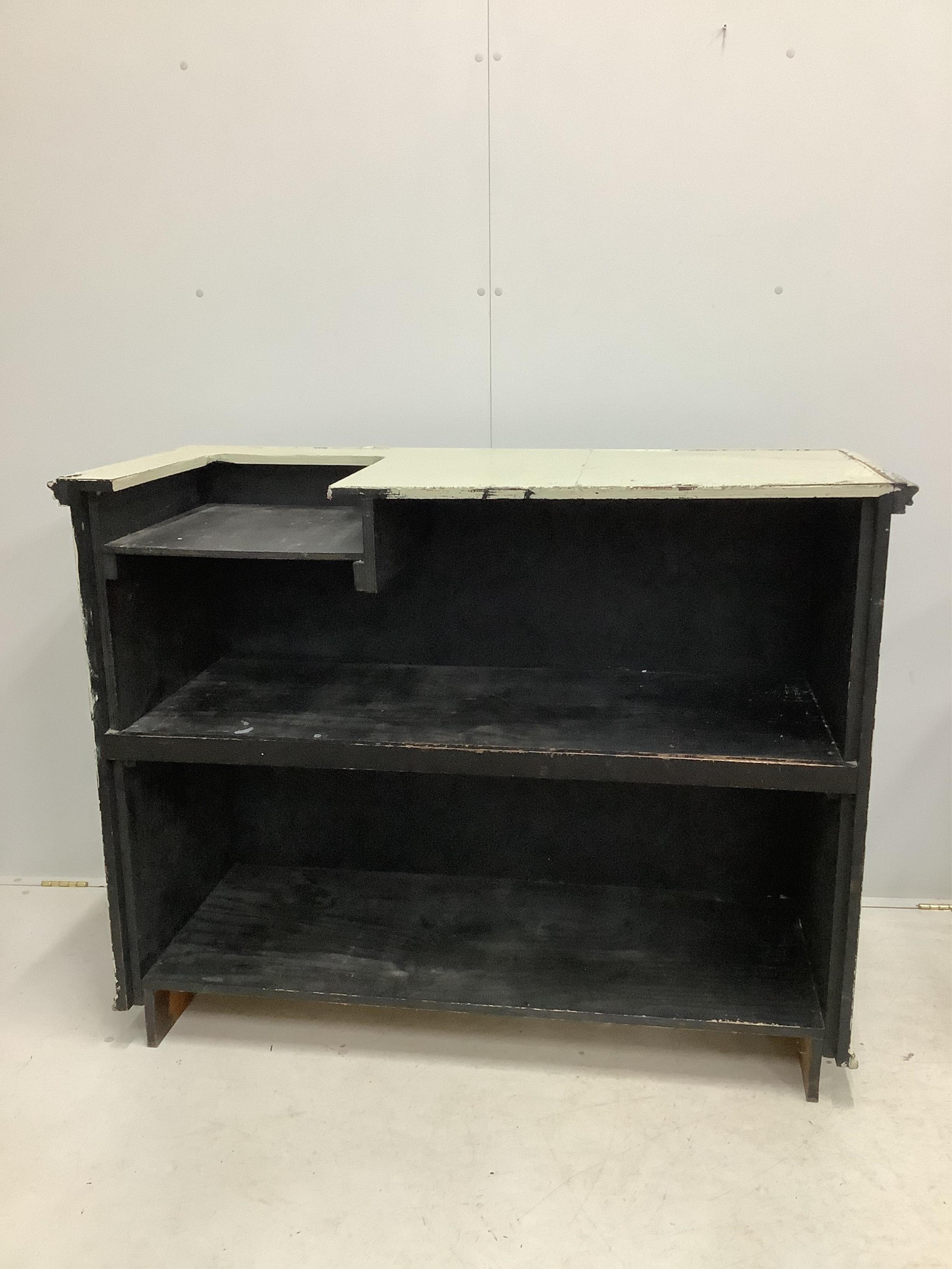 A painted panelled pine shop counter with till recess and chrome hanging rail. width 133cm, depth 60cm, height 104cm. Condition - poor to fair